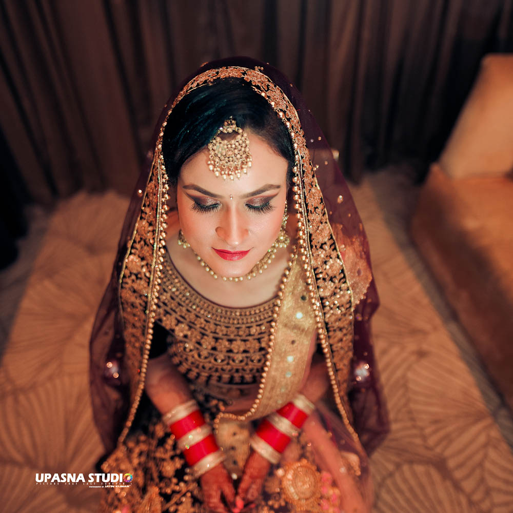 beautiful bride wearing red lehenga